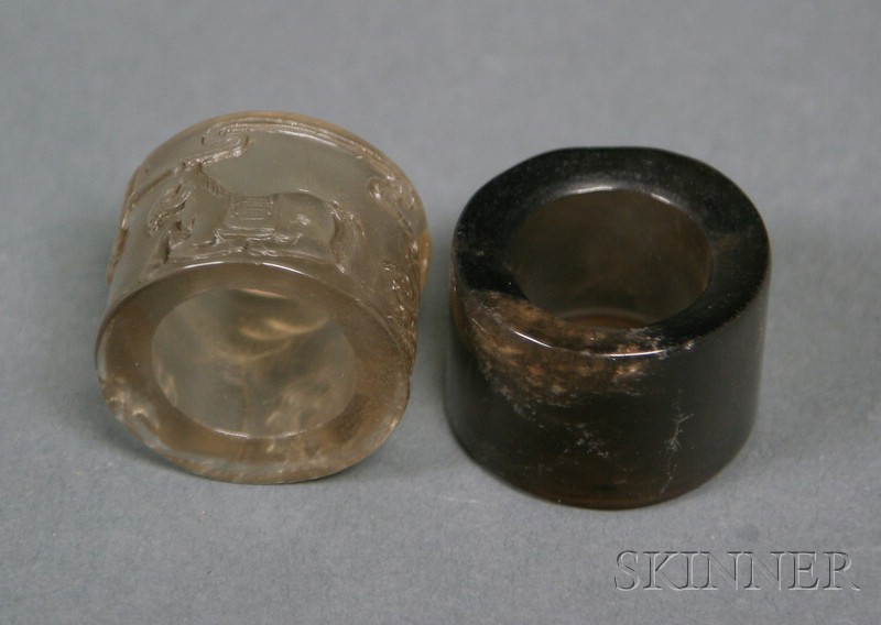 Appraisal: Two Archer's Rings China th century smoky quartz one carved