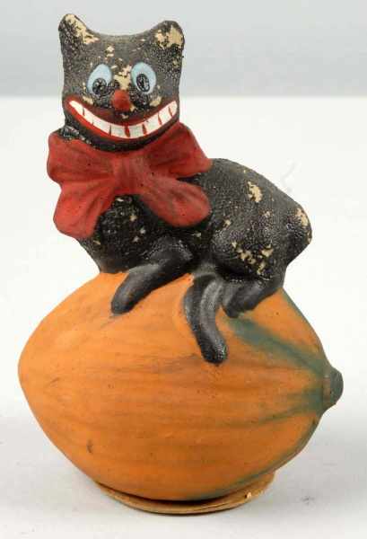 Appraisal: Rare German Halloween Cat Description Sits on pumpkin Paint loss