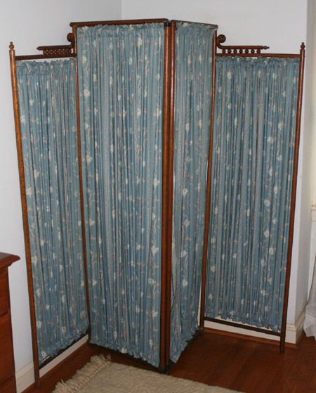 Appraisal: Victorian Oak and Floral Printed Blue Cotton Four-Panel Dressing Screen