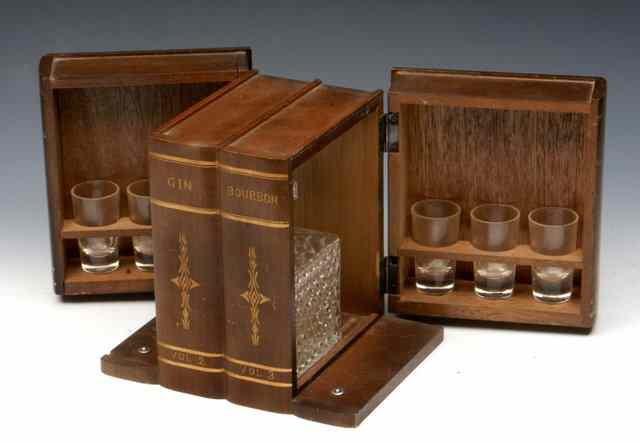 Appraisal: A NOVELTY DECANTER BOX in the form of four false