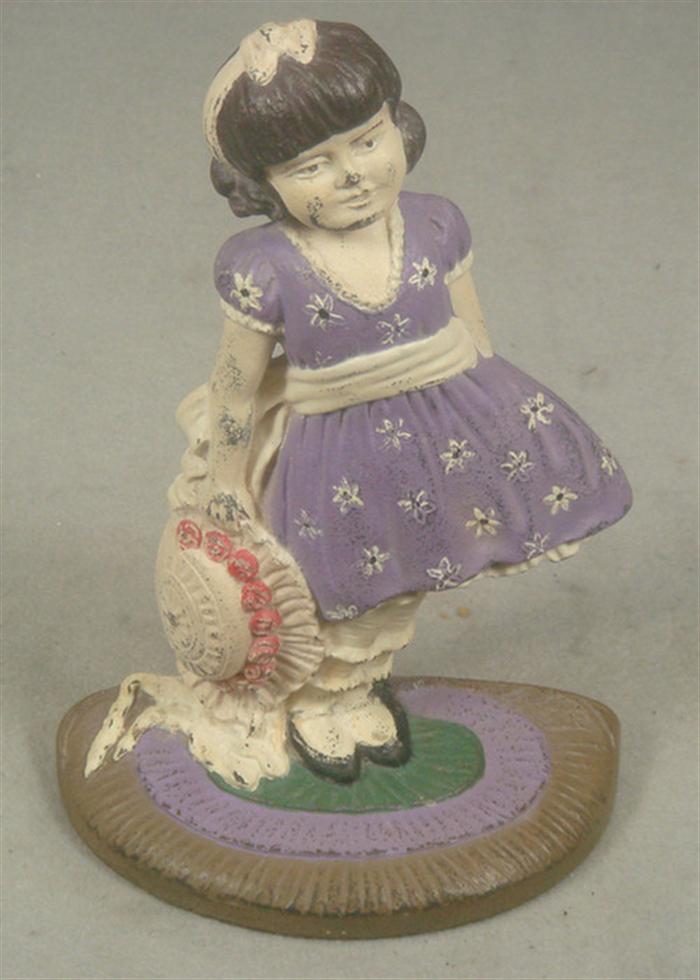 Appraisal: Cast iron doorstop young girl in purple dress and hat