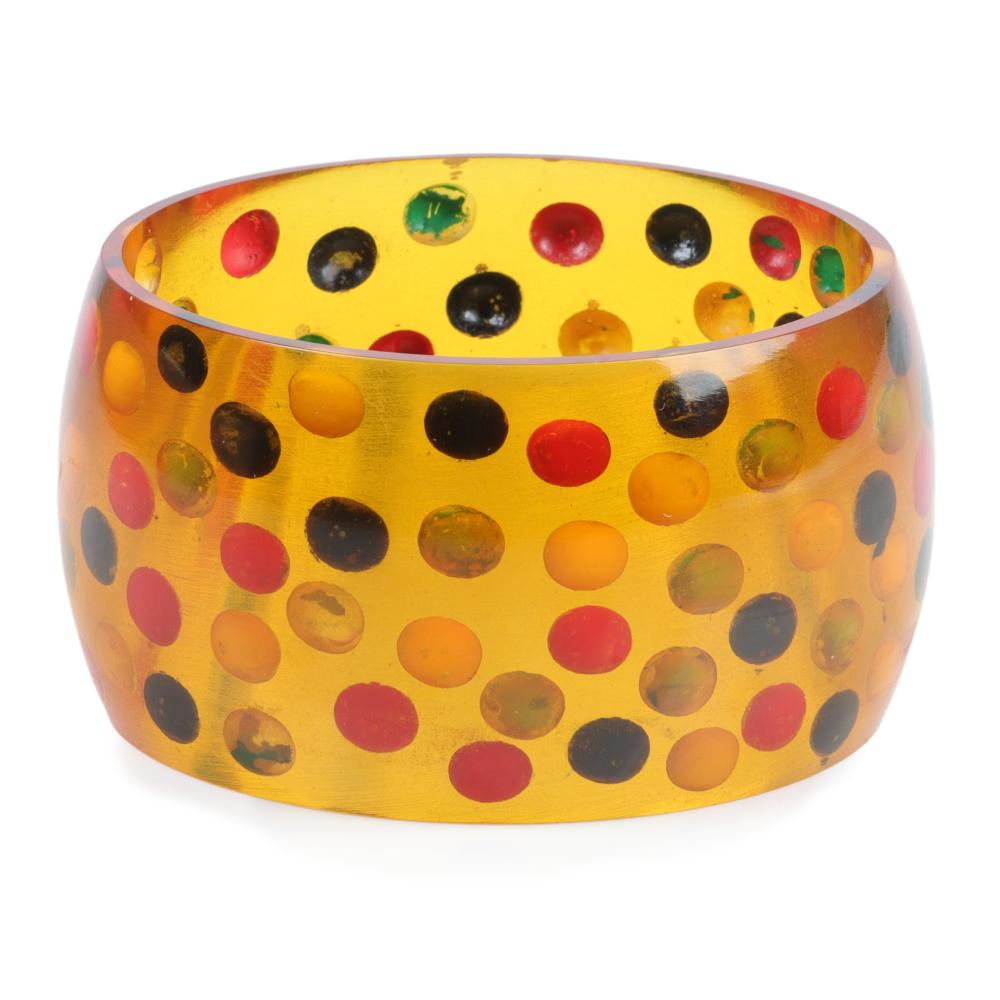 Appraisal: WIDE BAKELITE REVERSE CARVED AND PAINTED APPLE JUICE DOT BANGLE