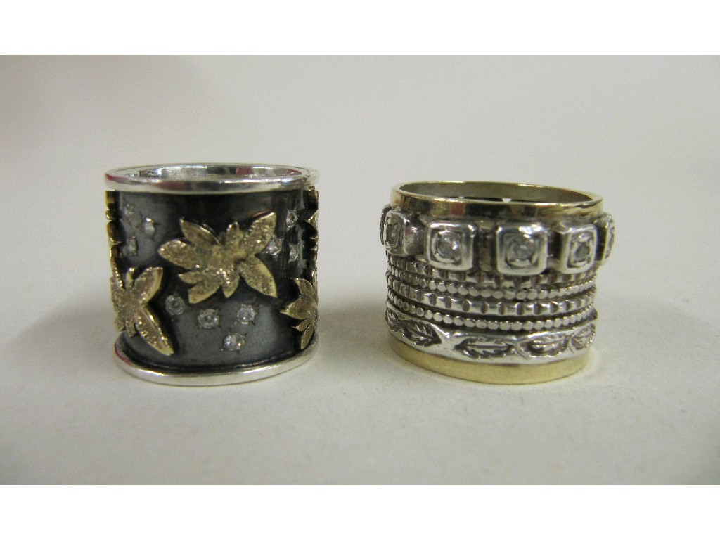 Appraisal: Two silver and gold gem set bands