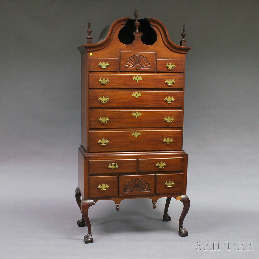 Appraisal: Chippendale-style Carved Mahogany Scroll-top High Chest the upper section with