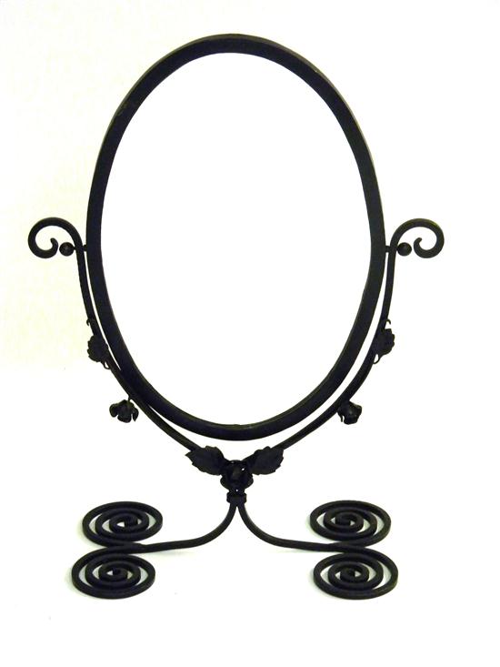 Appraisal: Large oval vanity mirror iron with scroll base applied rose