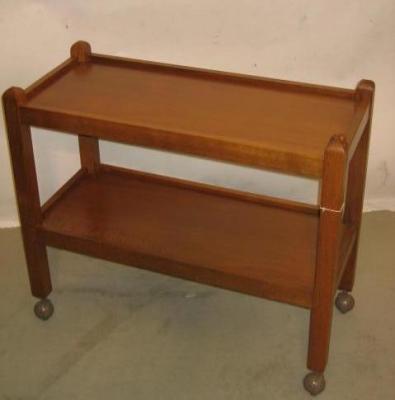 Appraisal: AN OAK TEA TROLLEY by Robert Mouseman Thompson of two