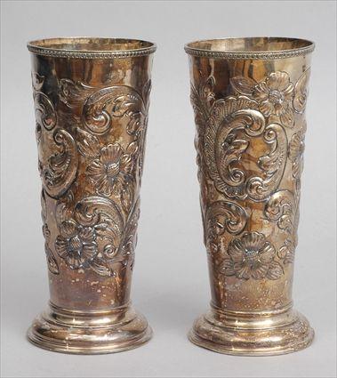 Appraisal: PAIR OF CONTINENTAL BAROQUE-STYLE SILVER-PLATED BEAKERS With pseudo hallmarks each