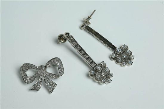 Appraisal: DIAMOND PIN AND PAIR OF EARRINGS Bow pin with four