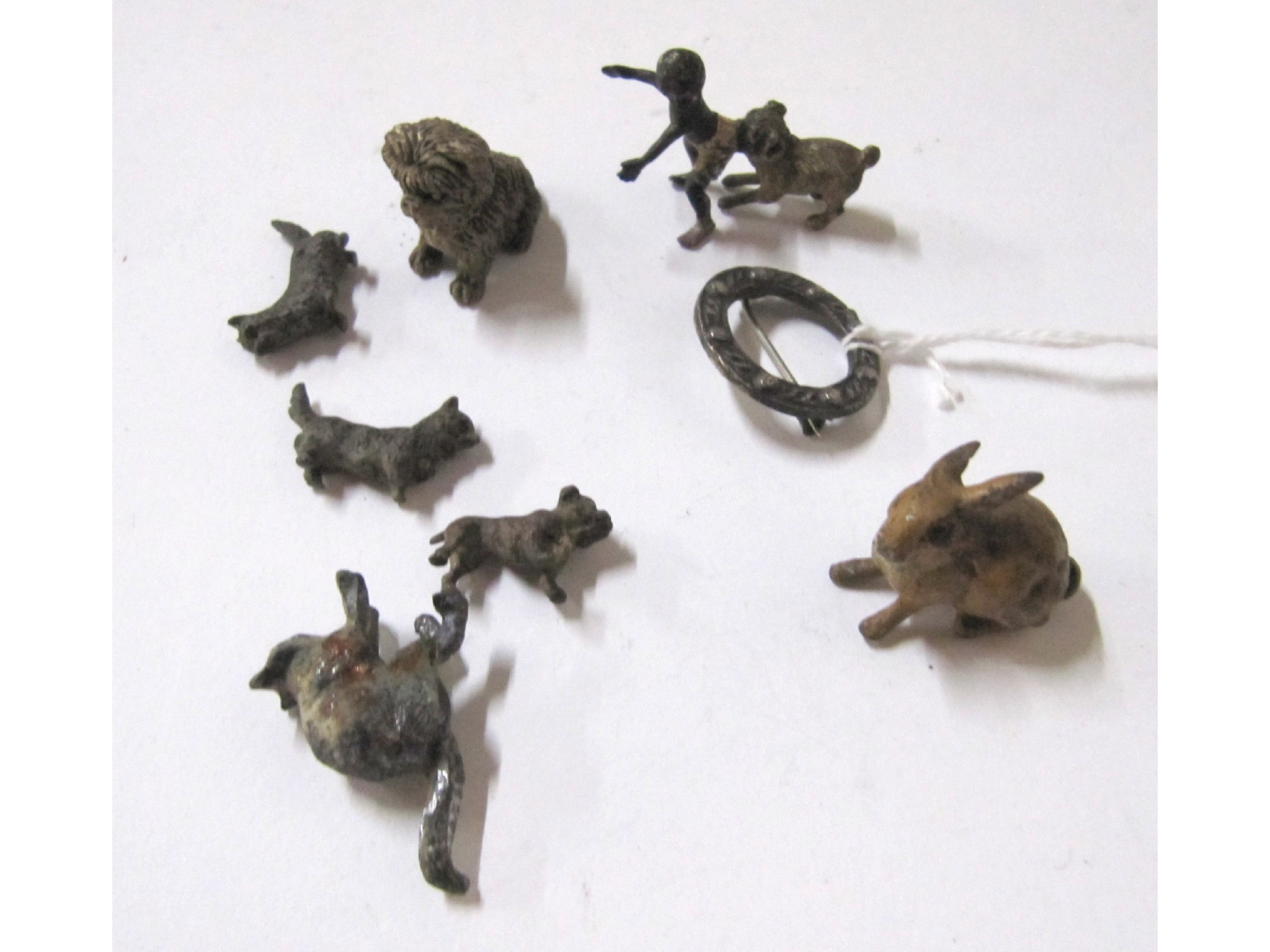 Appraisal: A lot comprising seven small cold painted bronze animal figures