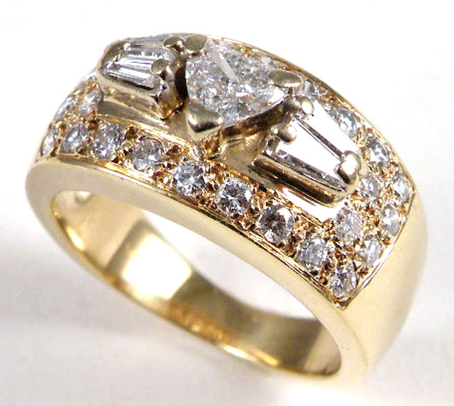 Appraisal: DIAMOND AND FOURTEEN KARAT GOLD RING centering a heart-cut diamond