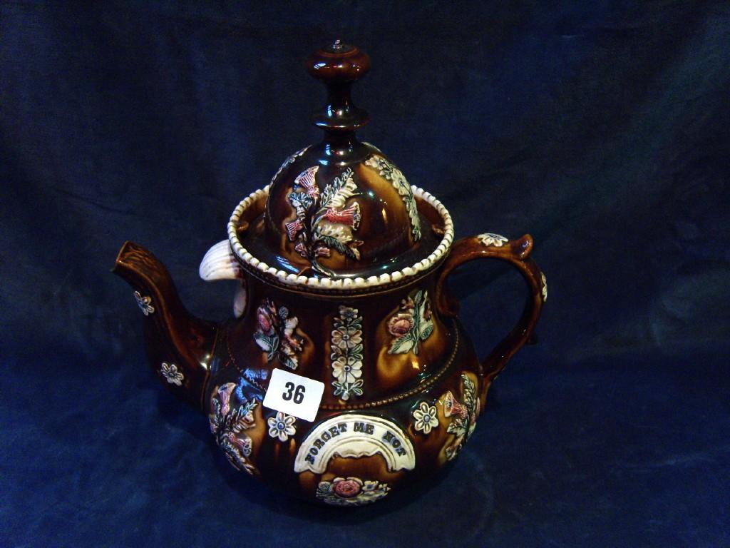 Appraisal: A th century Barge ware teapot and cover with applied