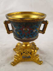 Appraisal: A gilt bronze champleve enamelled two handled incense burner probably