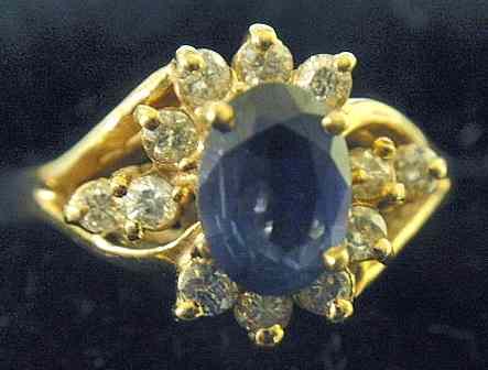 Appraisal: Sapphire diamond and k gold cocktail ring size center sapphire