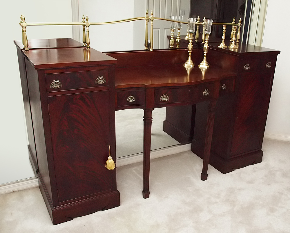 Appraisal: TH C ADAMS STYLE FLAME GRAIN MAHOGANY SIDEBOARD Shaped brass