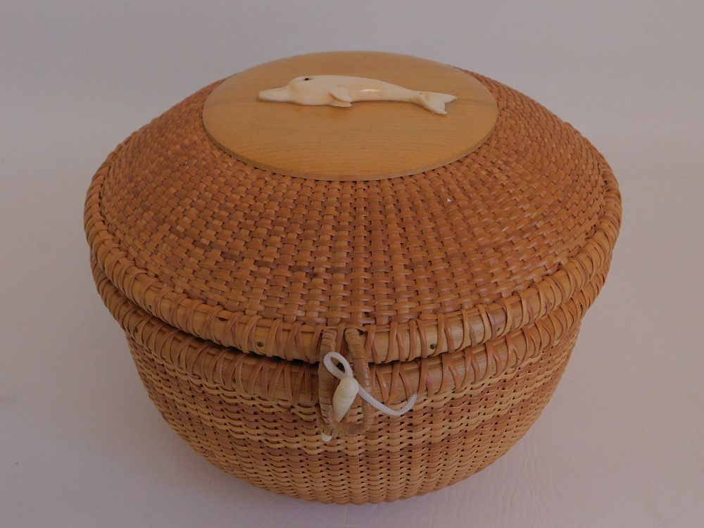 Appraisal: NANTUCKET BASKET WITH DOLPHIN PLAQUE Fine round Nantucket sewing or