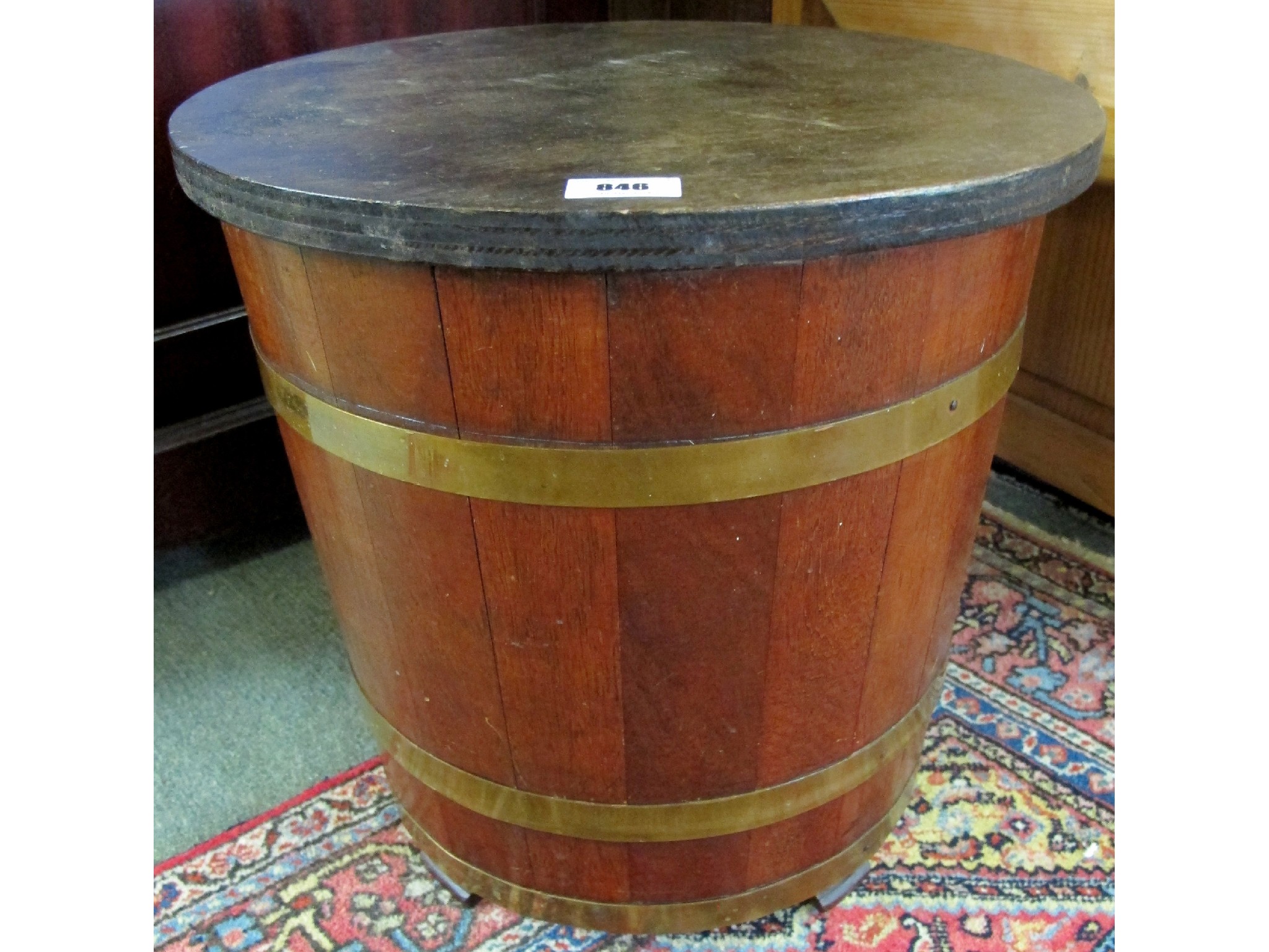 Appraisal: An oak brass coopered peat bucket by William Kemp Co