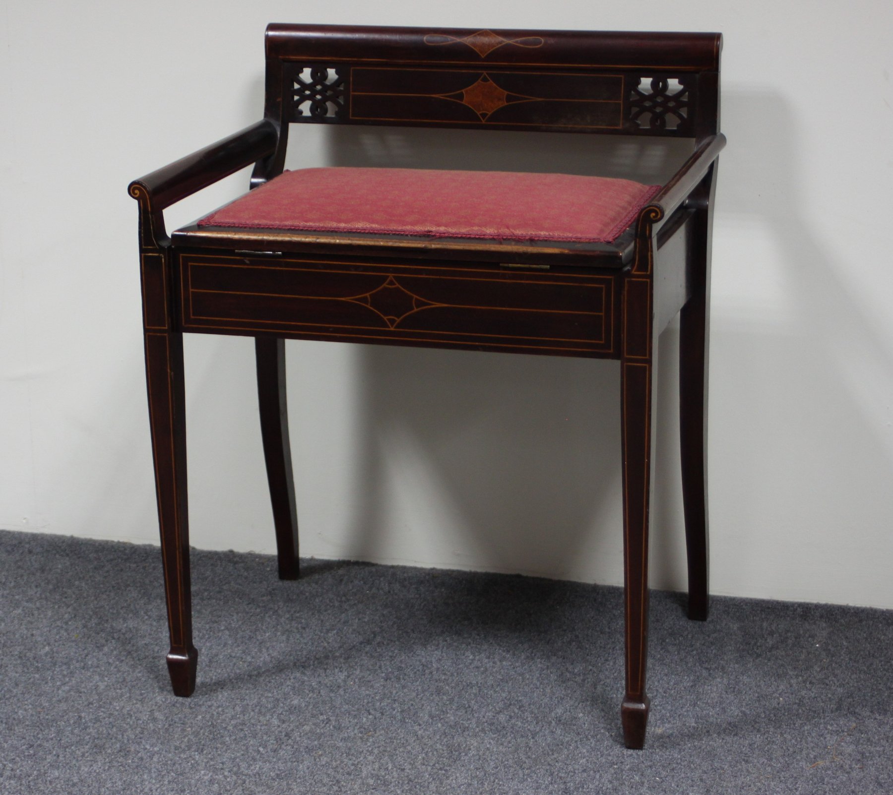 Appraisal: An Edwardian mahogany and inlaid piano stool with box seat