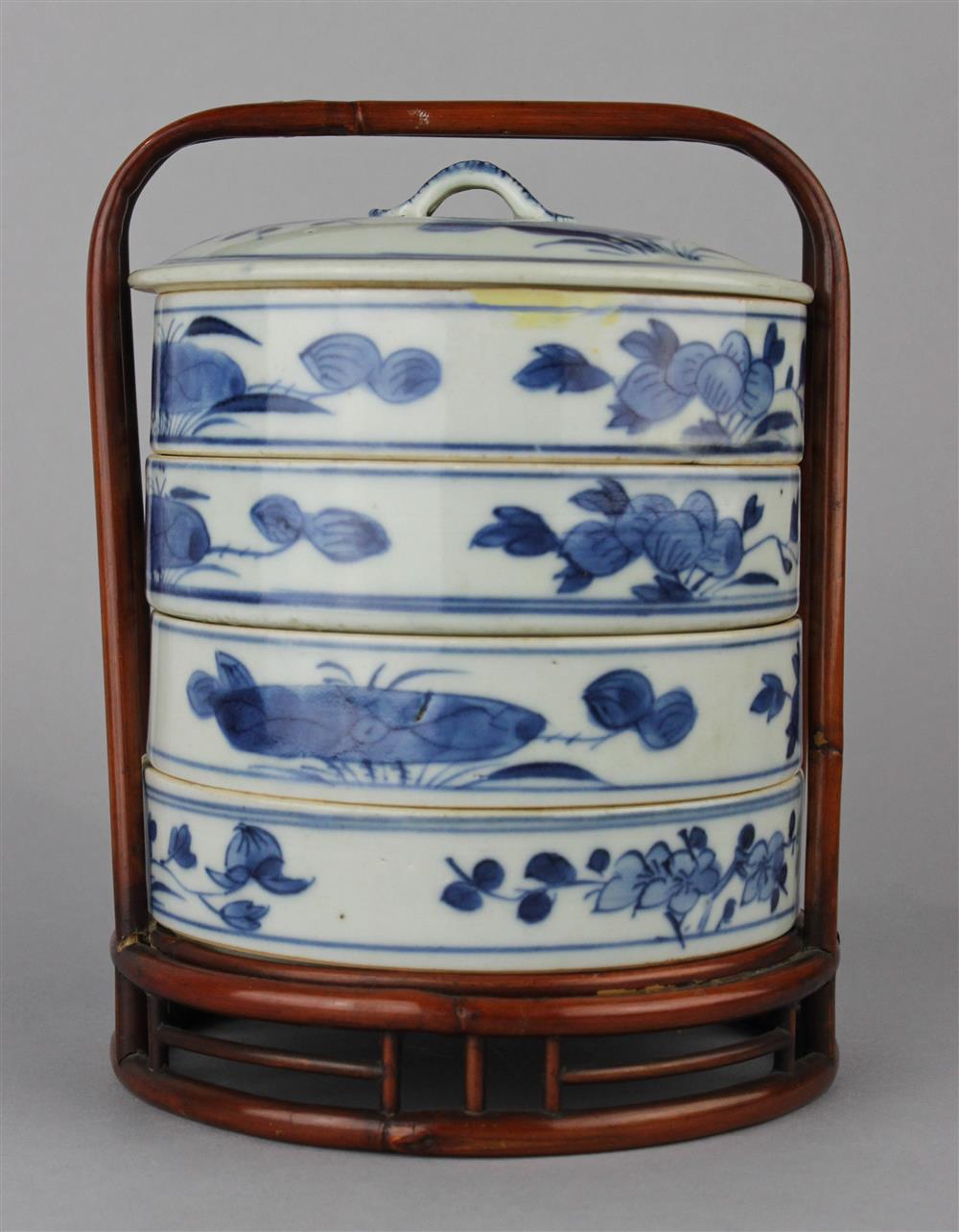 Appraisal: CHINESE BLUE AND WHITE -TIERED CIRCULAR BOX IN BAMBOO FRAME