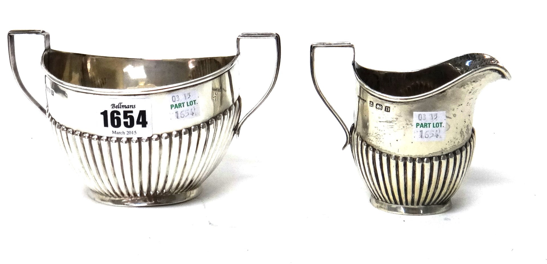 Appraisal: A silver twin handled sugar bowl and a matching milk