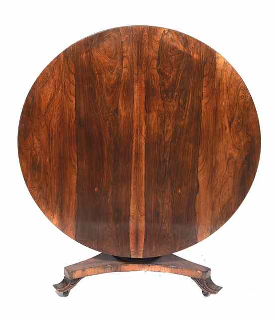 Appraisal: A VICTORIAN ROSEWOOD CIRCULAR BREAKFAST TABLE with figured top and