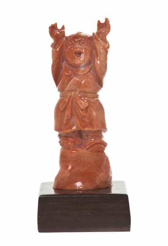 Appraisal: A Chinese Carved Coral Figure of a Young Boy depicted