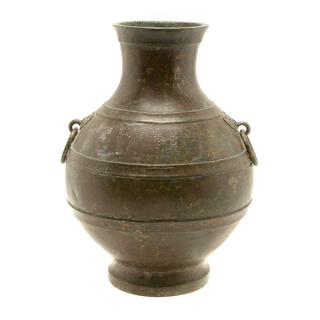 Appraisal: A Bronze Hu-Form Vase With registers of horizontal ribs and