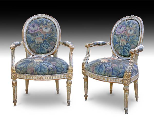 Appraisal: A pair of Italian Neoclassical parcel gilt green painted armchairs