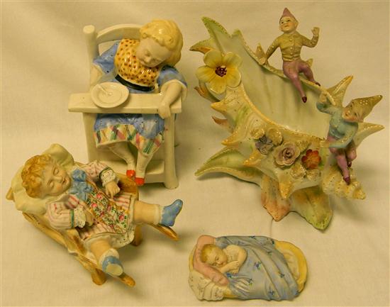 Appraisal: Four bisque pieces match safe reclining baby elves playing with