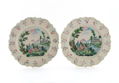 Appraisal: A pair of salt-glazed plates painted in polychrome enamels with