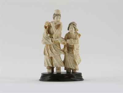 Appraisal: A Japanese ivory okimono of two female figures one playing