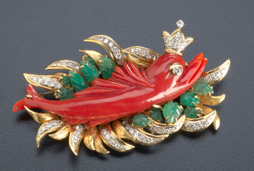 Appraisal: Dolphin King brooch with red coral emeralds and diamonds in