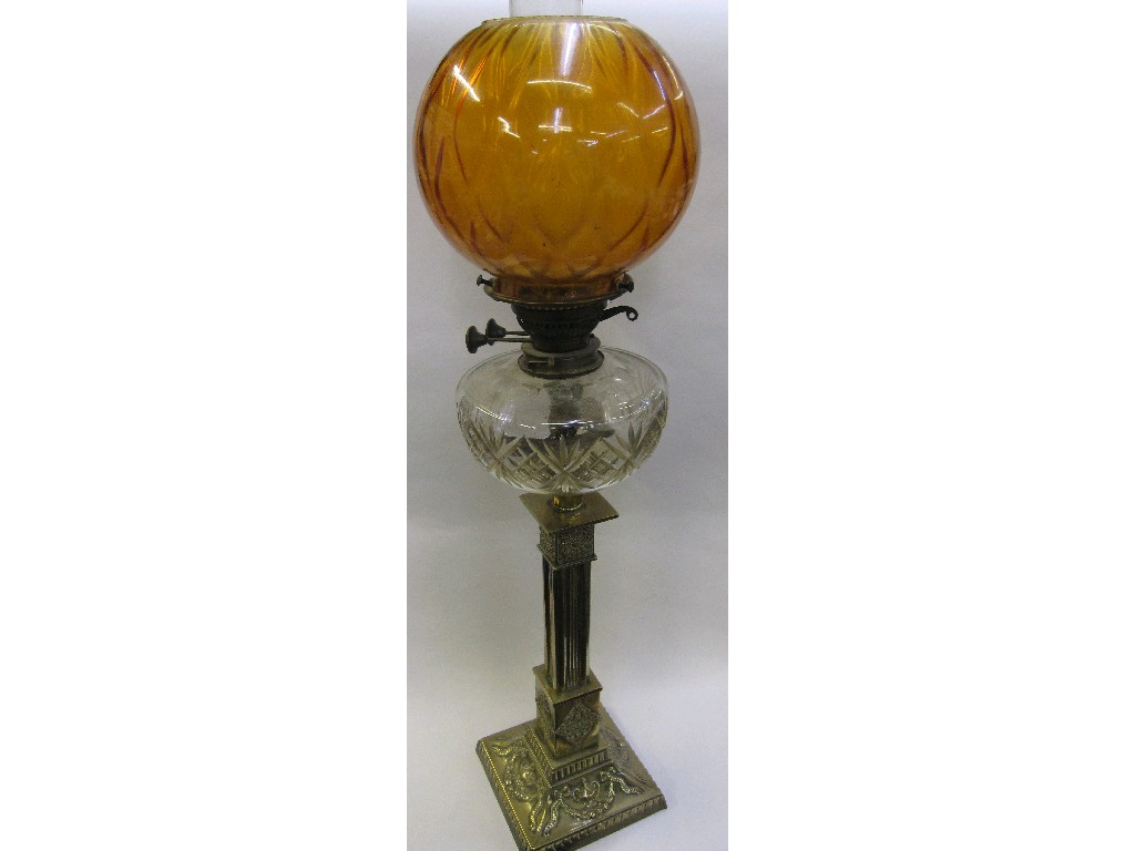 Appraisal: Victorian brass oil lamp with cut glass reservoir and amber