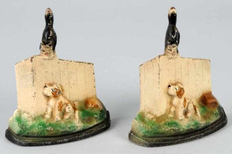 Appraisal: Cast Iron Dog Cat on Fence Bookends Description Made by