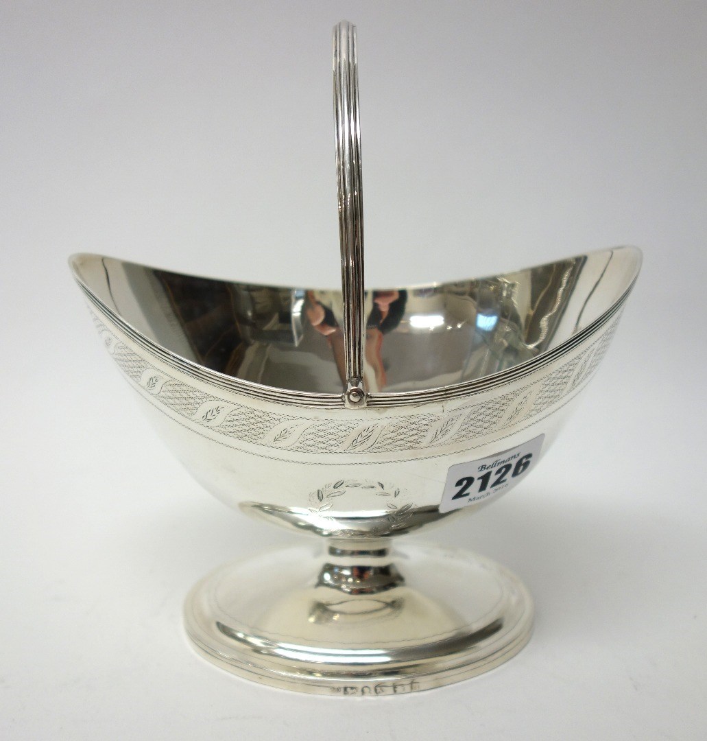 Appraisal: A George III silver sugar basket of oval form with