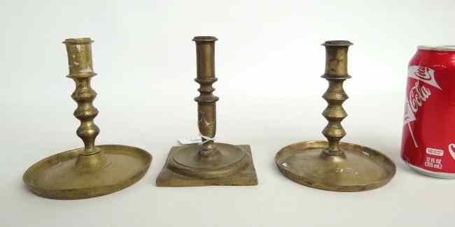 Appraisal: Lot three th c brass candlesticks '' to '' Ht