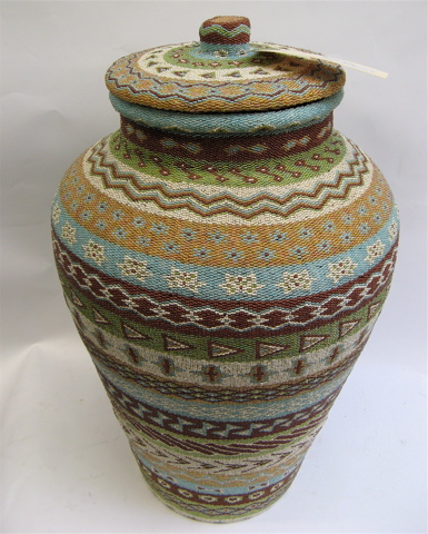 Appraisal: LARGE INDONESIAN FLOOR VASE WITH FITTED COVER the exterior having