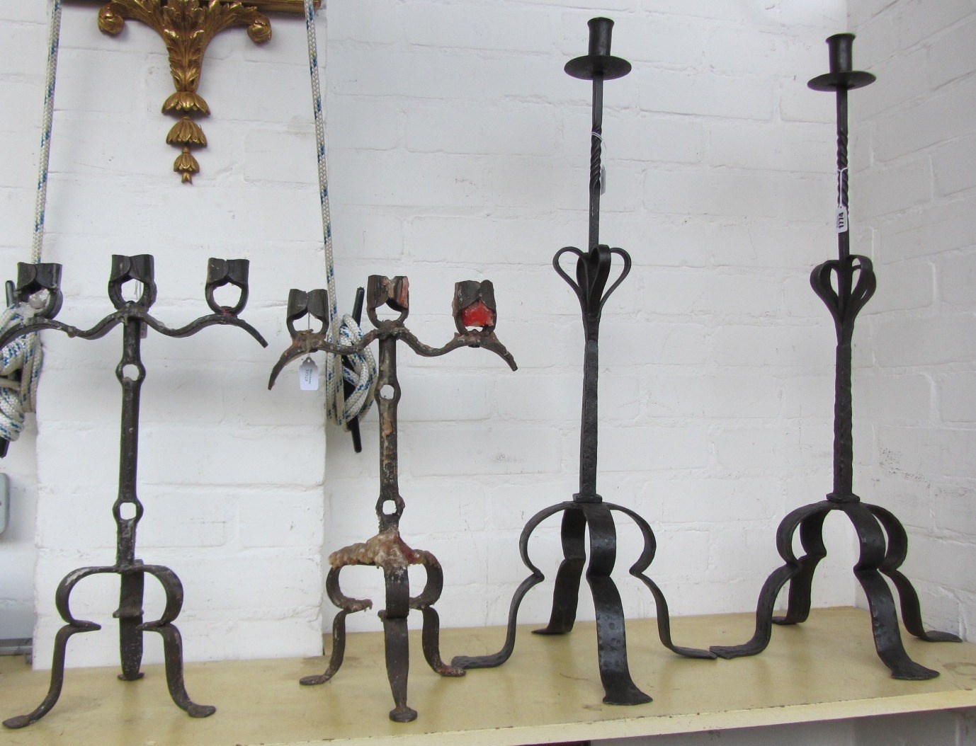 Appraisal: A pair of Arts Crafts wrought iron candlesticks with spiral