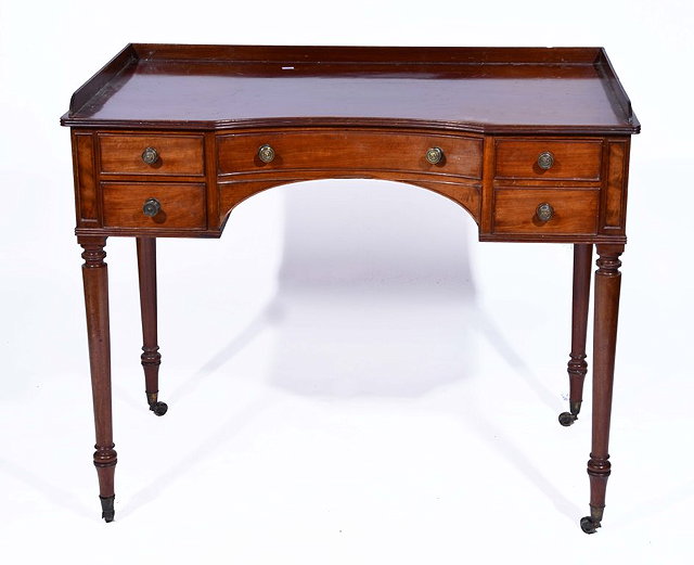 Appraisal: A VICTORIAN MAHOGANY DRESSING TABLE with inverted bow front with