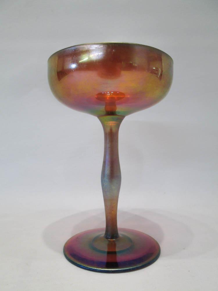 Appraisal: GOLD IRIDESCENT ART GLASS CHAMPAGNE GOBLET with tall stem and