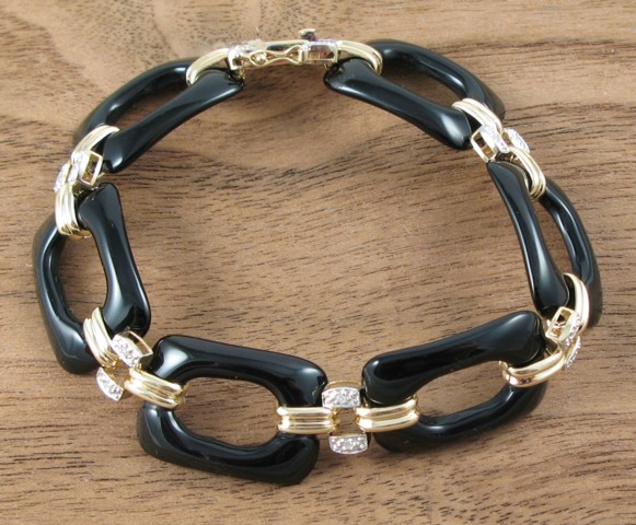 Appraisal: BLACK ONYX AND DIAMOND BRACELET k yellow gold and -