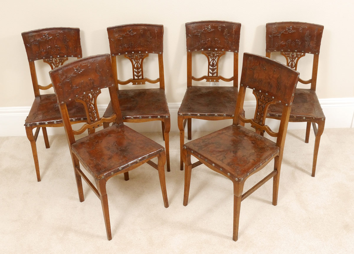 Appraisal: SET OF GERMAN EMBOSSED LEATHER CHAIRS Embossed tacked leather backs