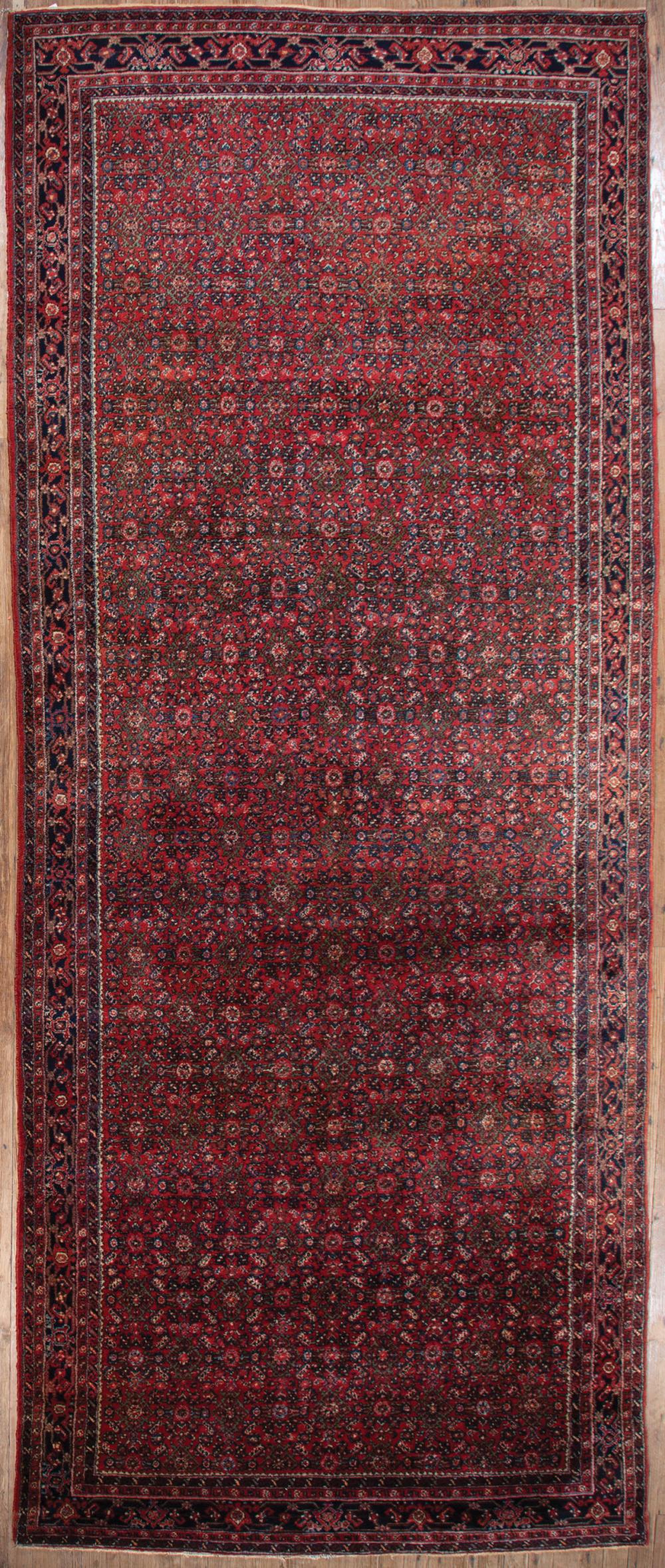 Appraisal: Semi-Antique Persian Hall Runner red ground overall stylized foliate design