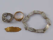 Appraisal: A mixed lot comprising a carat gold buckle ring size