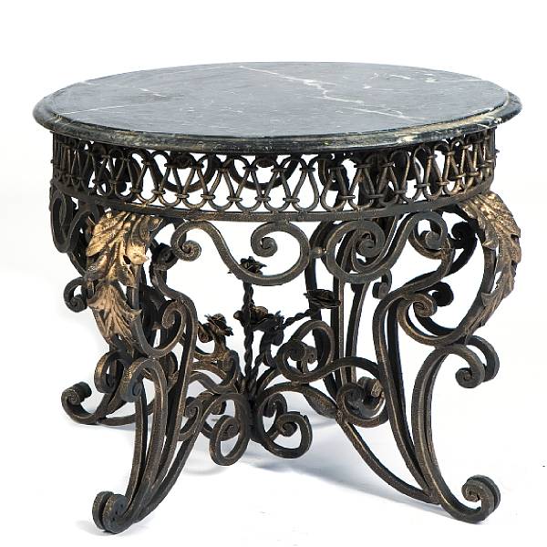 Appraisal: A pair of parcel gilt wrought iron marble topped tables