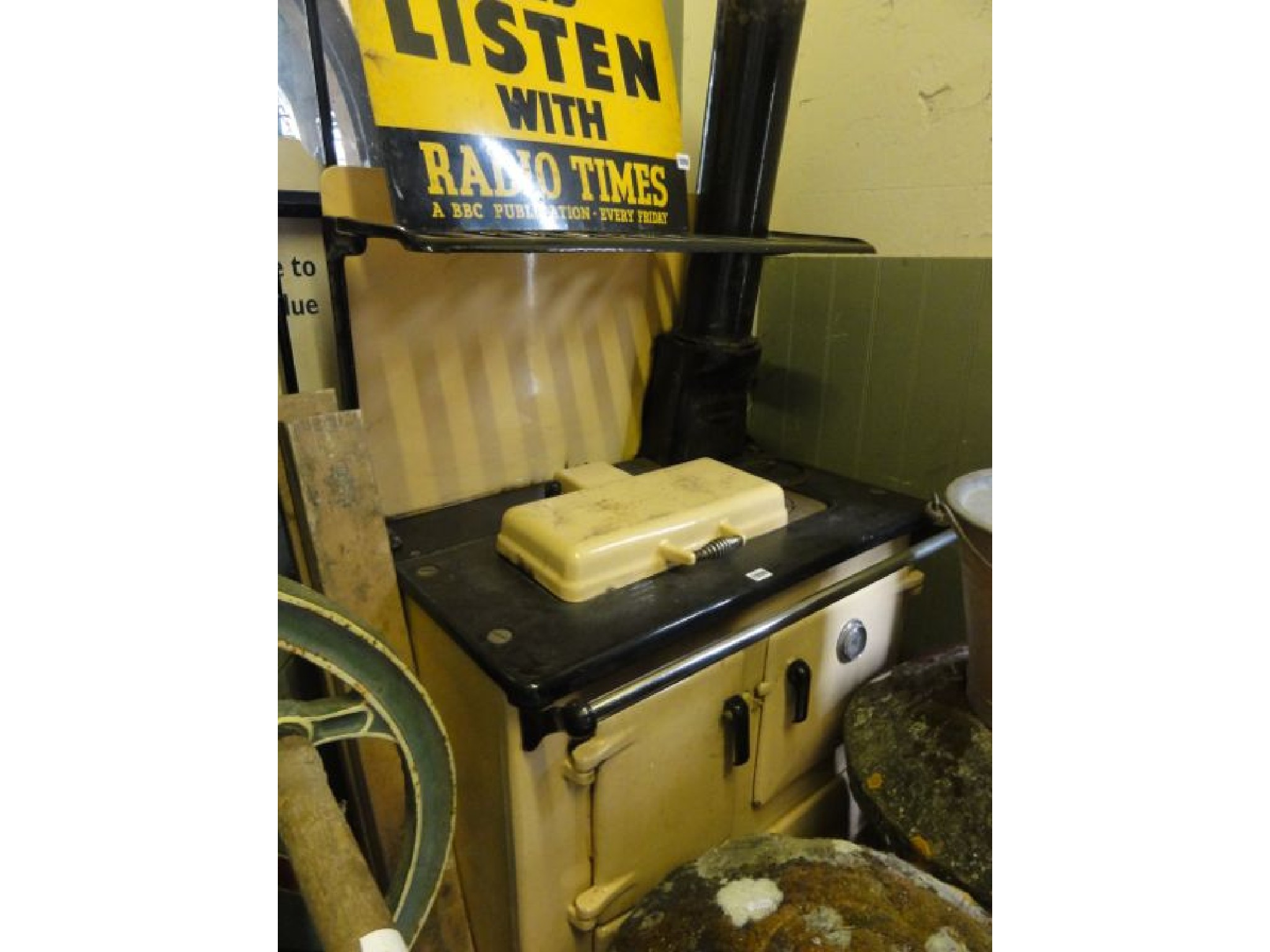 Appraisal: A vintage cast iron and enamel Rayburn enclosed by four