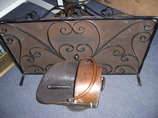 Appraisal: A copper coal scuttle and wrought iron wire mesh spark