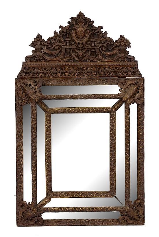 Appraisal: A Dutch Repousse Brass Cushion Mirror Height x width inches