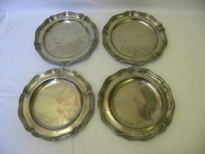 Appraisal: A SET OF FOUR PEWTER PLATES of pentagonal wavy edge