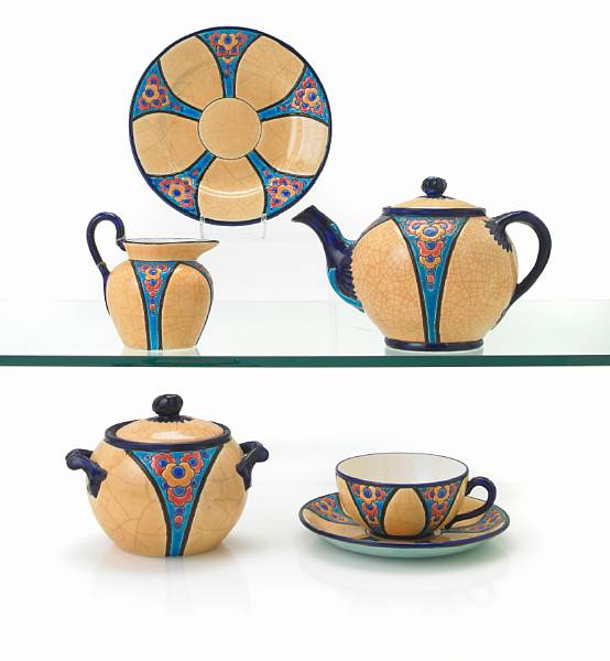 Appraisal: A Longwy glazed and enamel decorated earthenware part tea service