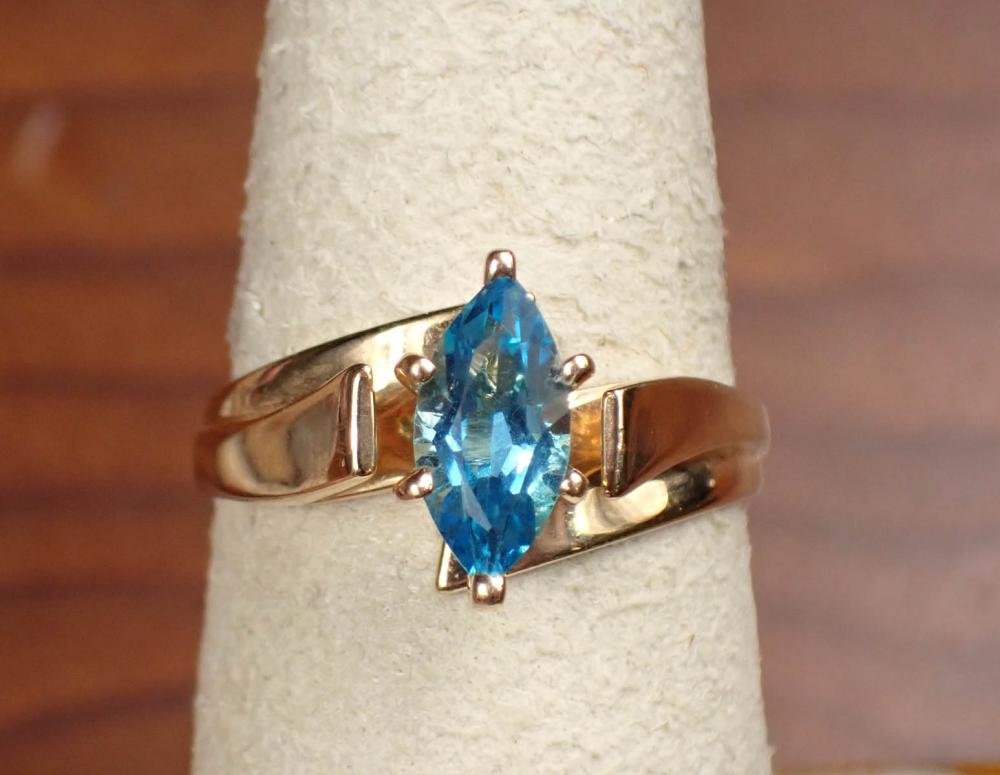 Appraisal: BLUE TOPAZ AND FOURTEEN KARAT GOLD SOLITAIRE RING The yellow